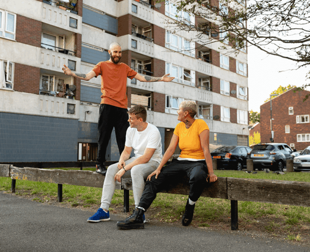 full-shot-friends-sitting-together-suburbs