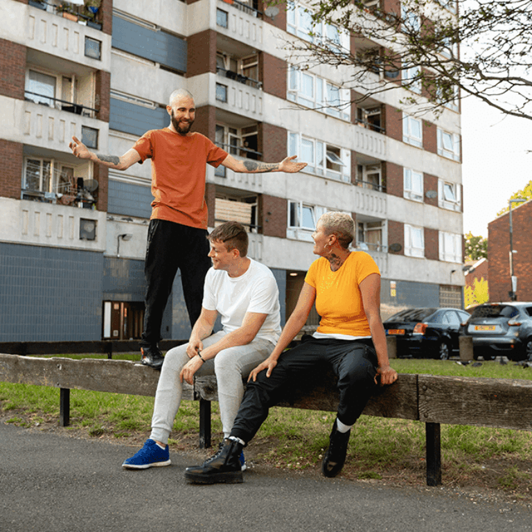 full-shot-friends-sitting-together-suburbs